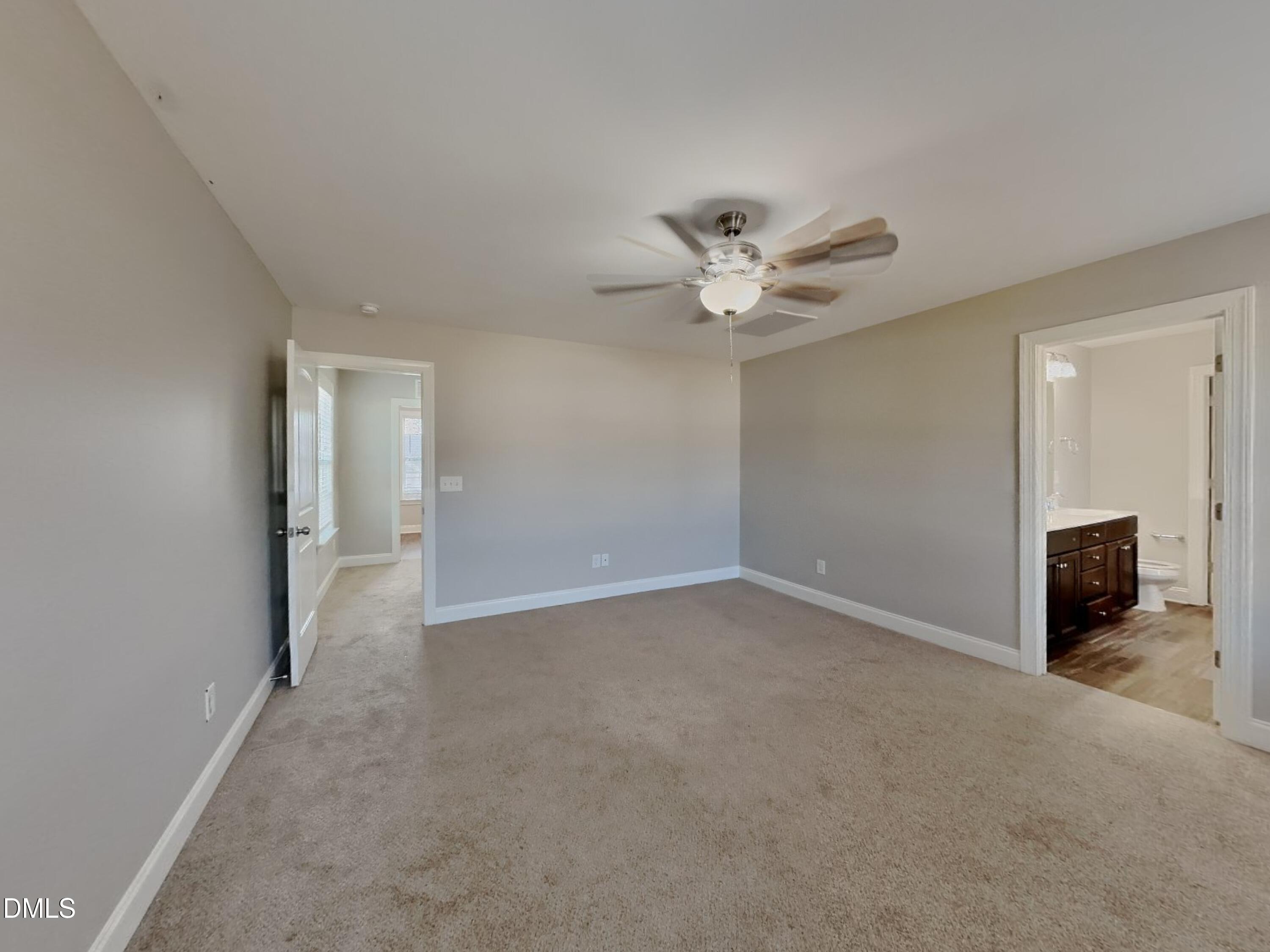 93 Jonalker Court Clayton, NC 27520 - Photo 6 of 17 an empty room with closet and windows