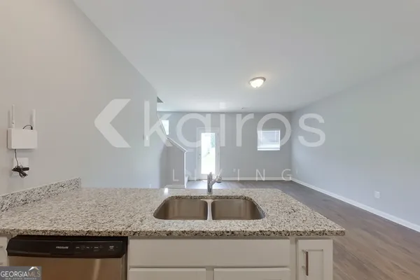 a kitchen with granite countertop a sink and a granite counter tops