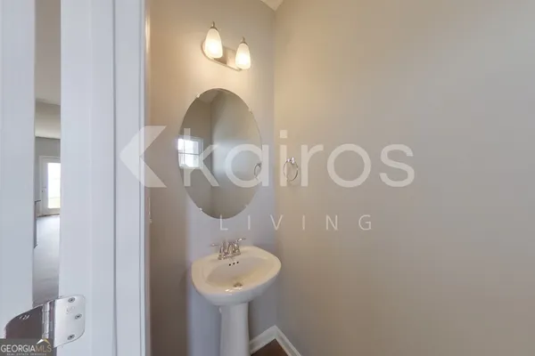 a bathroom with a sink and mirror