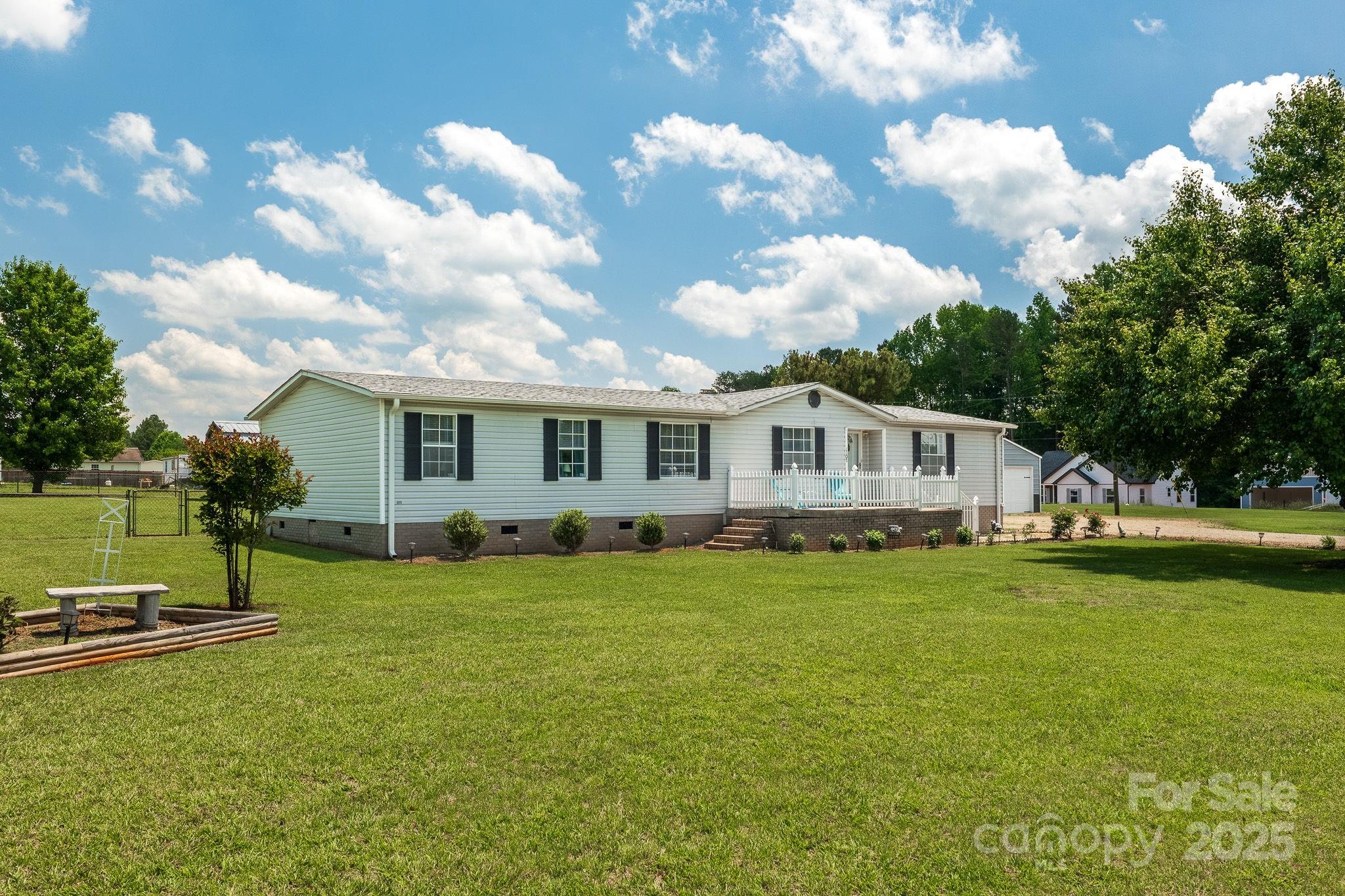 1107 Richard Road Salisbury, NC 28147 - Photo 1 of 35 a front view of a house with garden