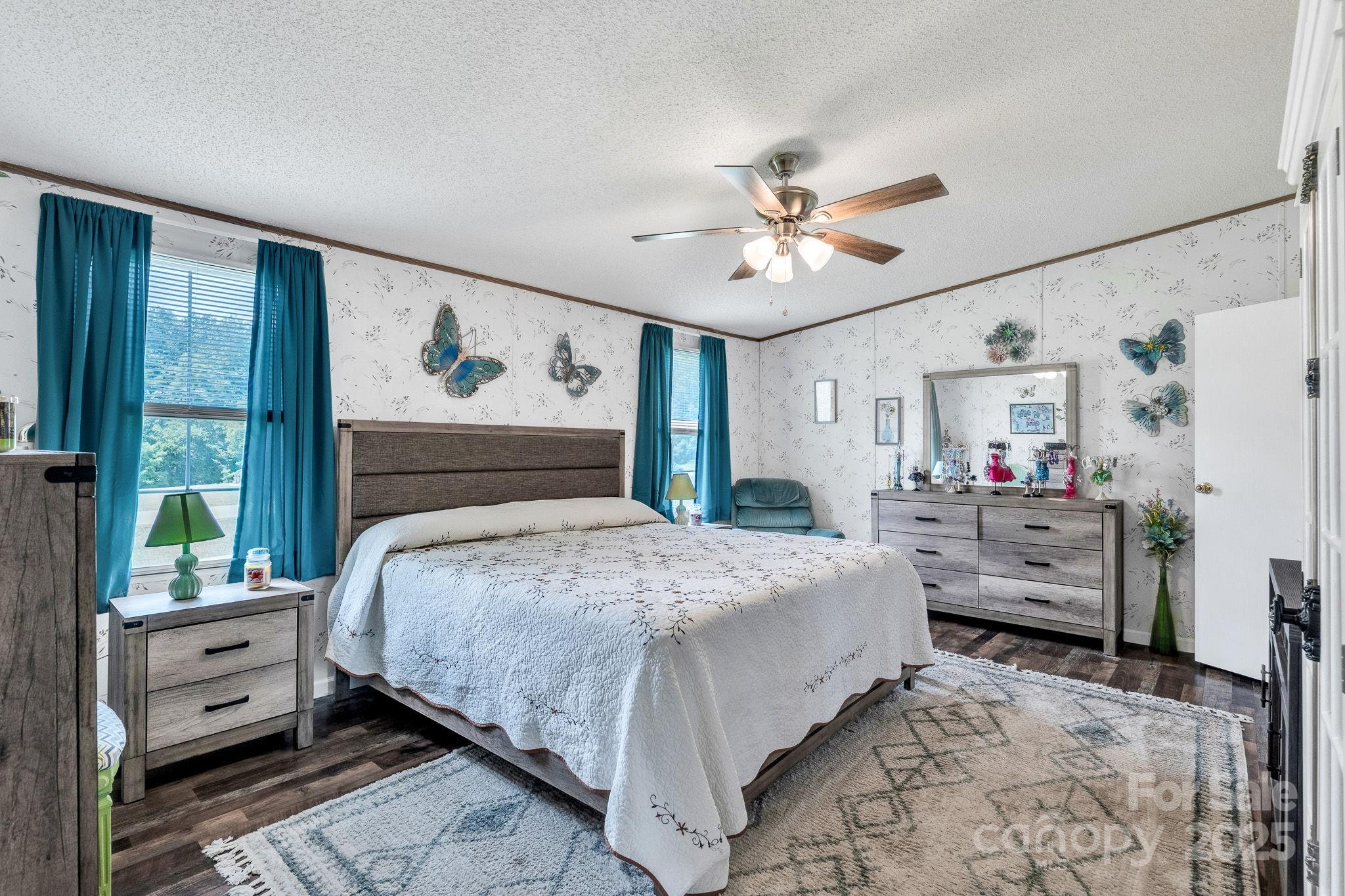 1107 Richard Road Salisbury, NC 28147 - Photo 16 of 35 a bedroom with a bed and ceiling fan
