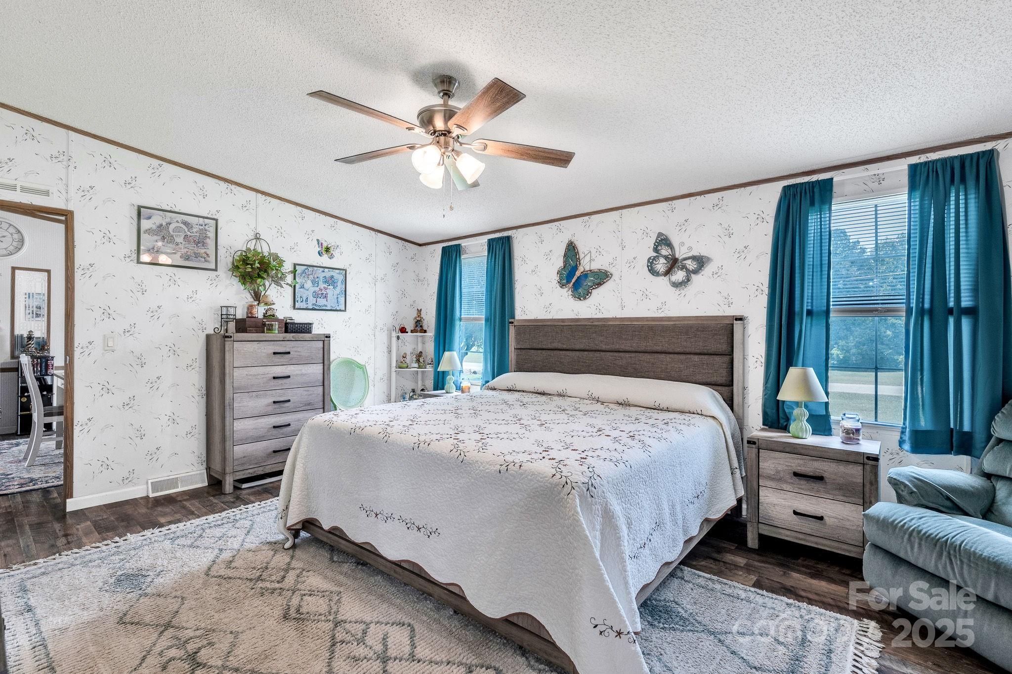 1107 Richard Road Salisbury, NC 28147 - Photo 17 of 35 a bedroom with a bed and a chandelier