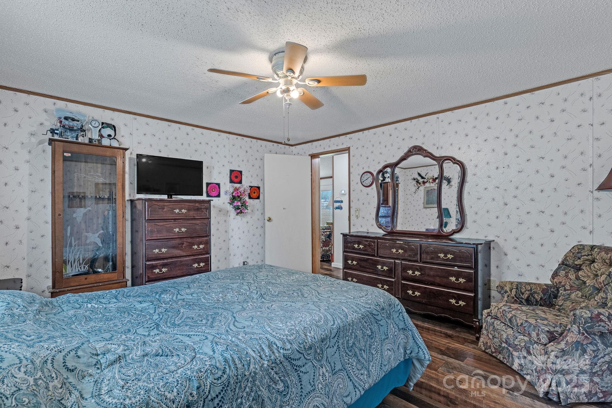 1107 Richard Road Salisbury, NC 28147 - Photo 25 of 35 a bedroom with a bed and a flat tv screen on dresser