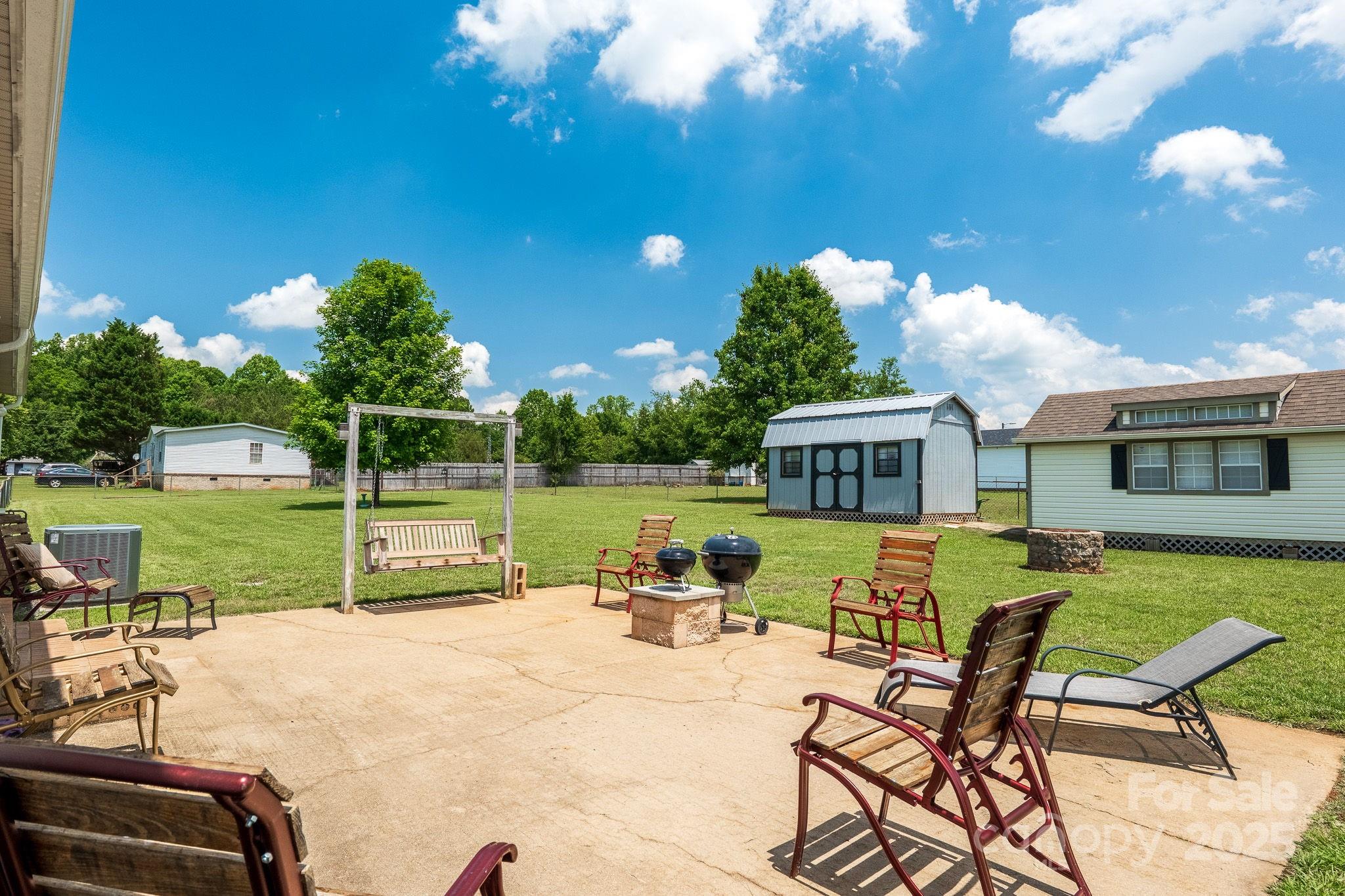 1107 Richard Road Salisbury, NC 28147 - Photo 27 of 35 a view of a house with backyard porch and sitting area