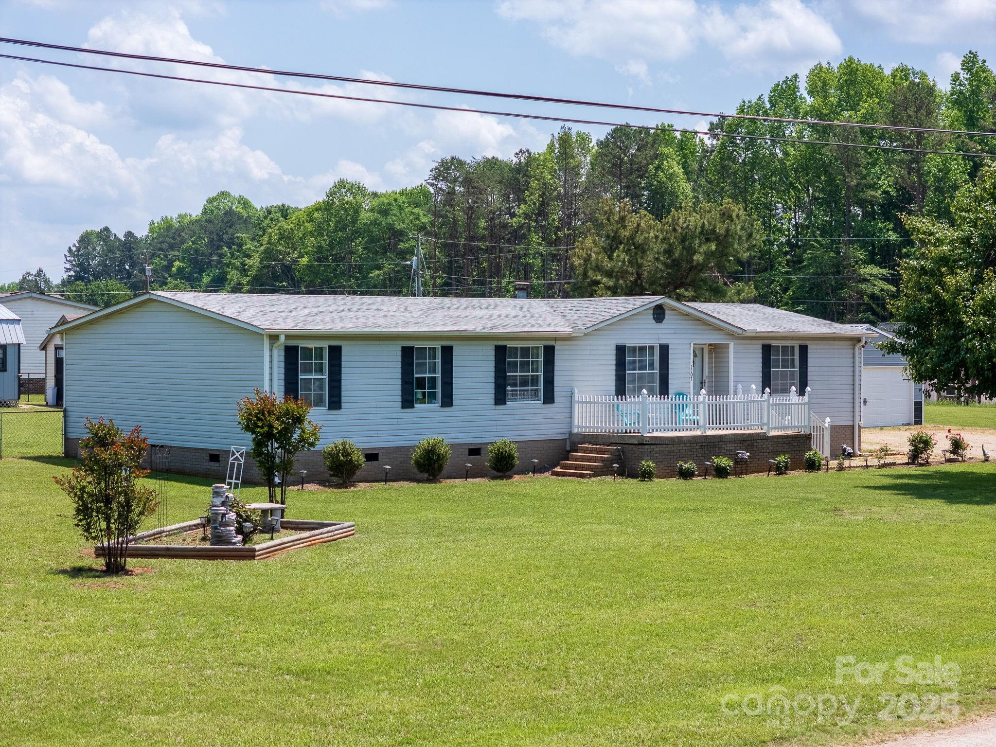 1107 Richard Road Salisbury, NC 28147 - Photo 35 of 35 a view of a house with a yard patio and swimming pool