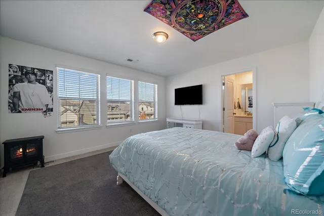 a bed room with a bed and a couch