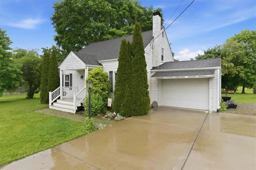 344 Winfield Road Cabot, PA 16023 - Photo 2 of 30 a front view of a house with garden