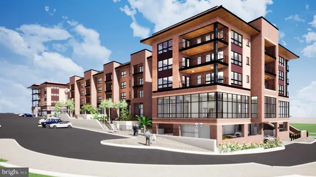 a table and chairs in front of a white house