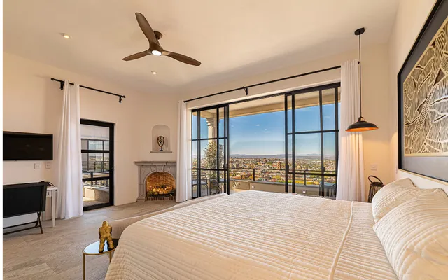 a bedroom with a bed and a television