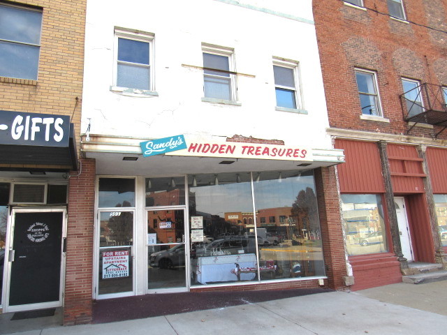 a view of a brick building with a large window