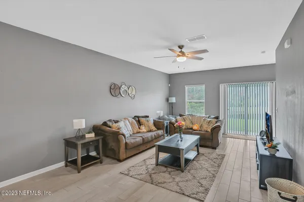 a living room with furniture and a large window
