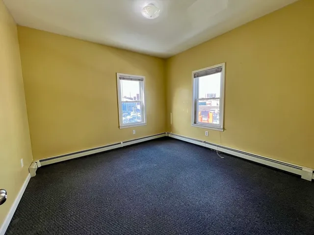 a view of a room that has a window in it