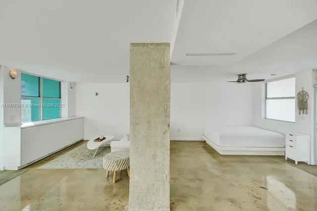 a bathroom with a shower and a sink