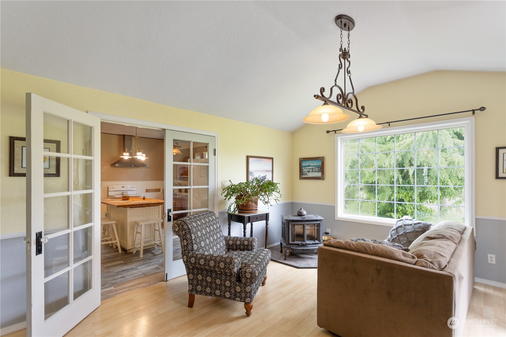 12129 Independence Road Southwest Rochester, WA 98579 - Photo 14 of 37 a living room with furniture and a chandelier