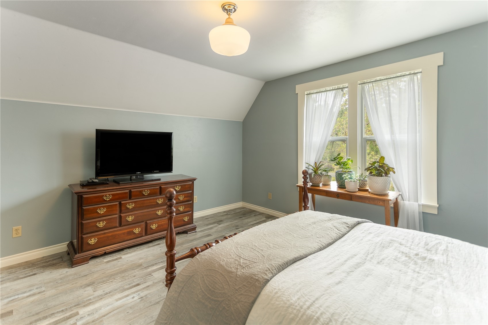 12129 Independence Road Southwest Rochester, WA 98579 - Photo 23 of 37 a bedroom with a bed and a flat screen tv