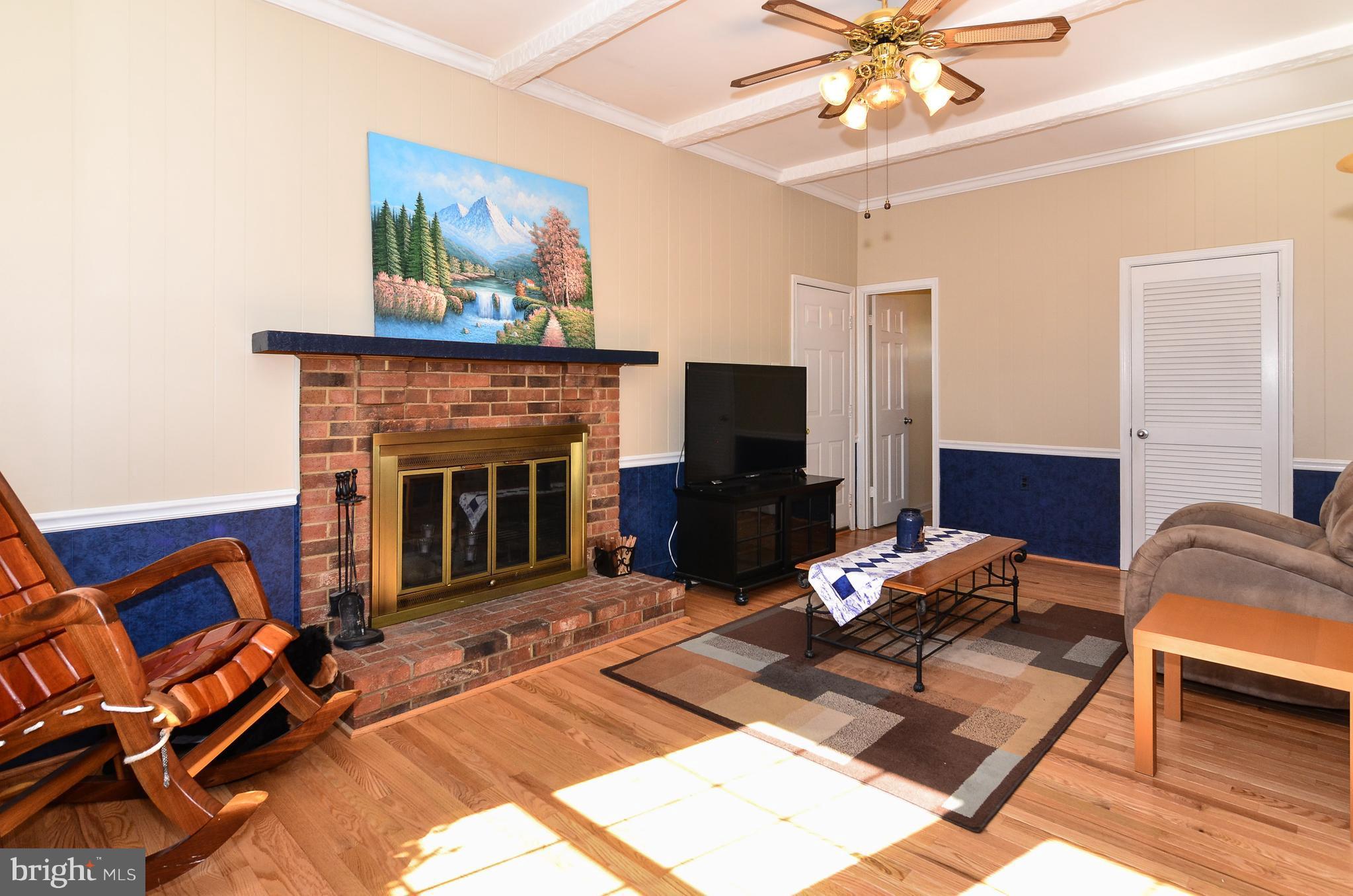 3008 Seminole Road Woodbridge, VA 22192 - Photo 13 of 30 Family room with new hardwood floors and fpl