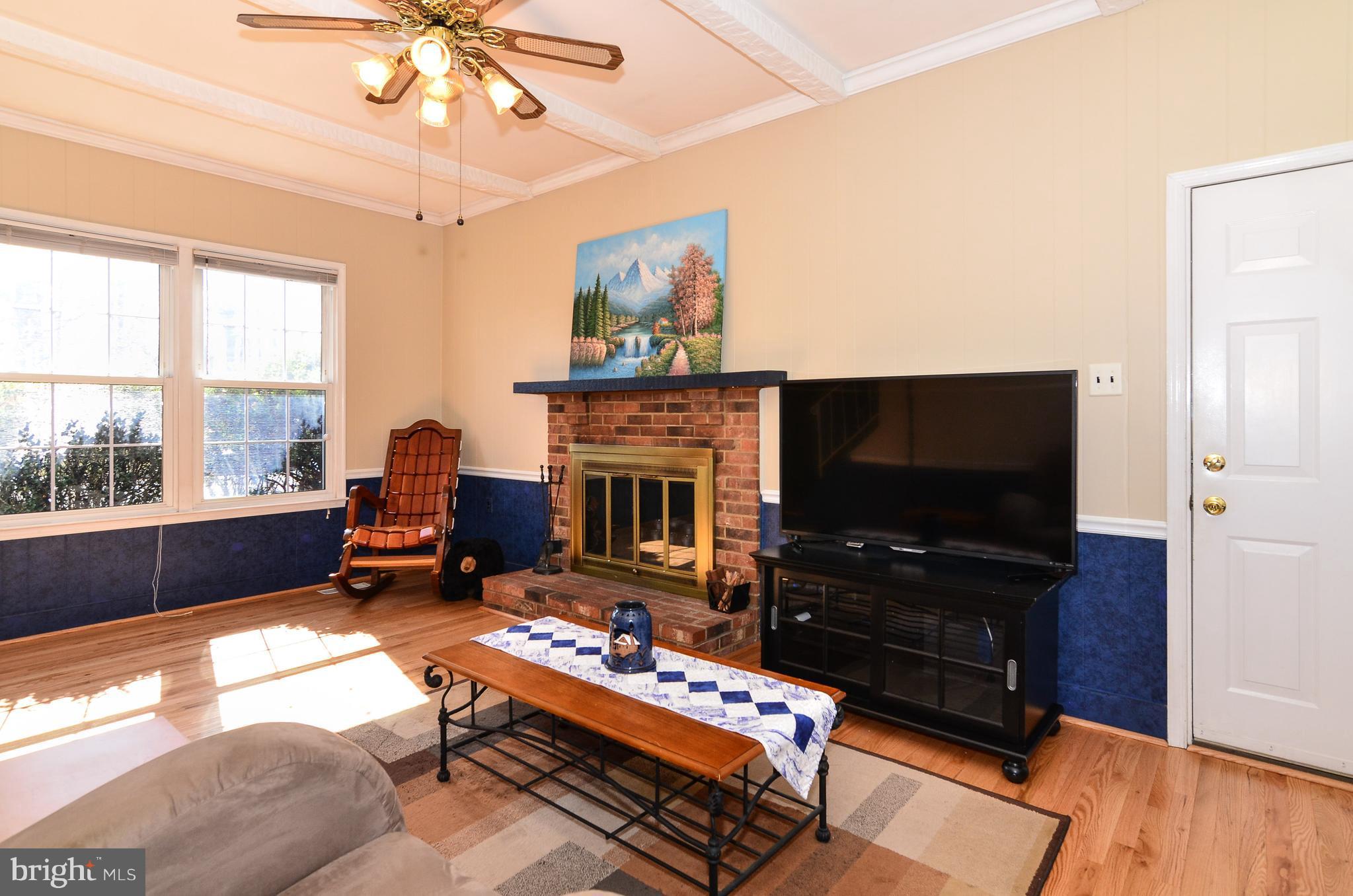 3008 Seminole Road Woodbridge, VA 22192 - Photo 14 of 30 Family room with new hardwood floors and fpl