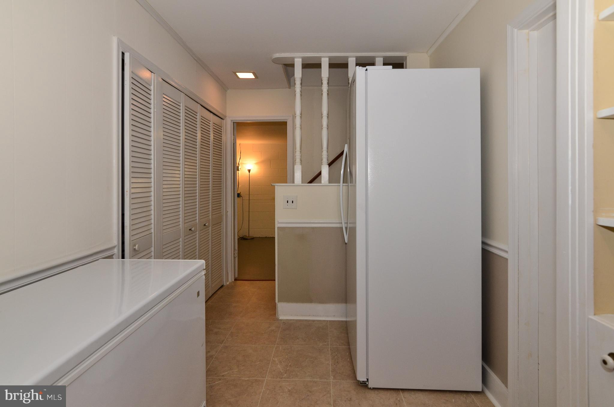 3008 Seminole Road Woodbridge, VA 22192 - Photo 22 of 30 Lower level hall way with a freezer that conveys