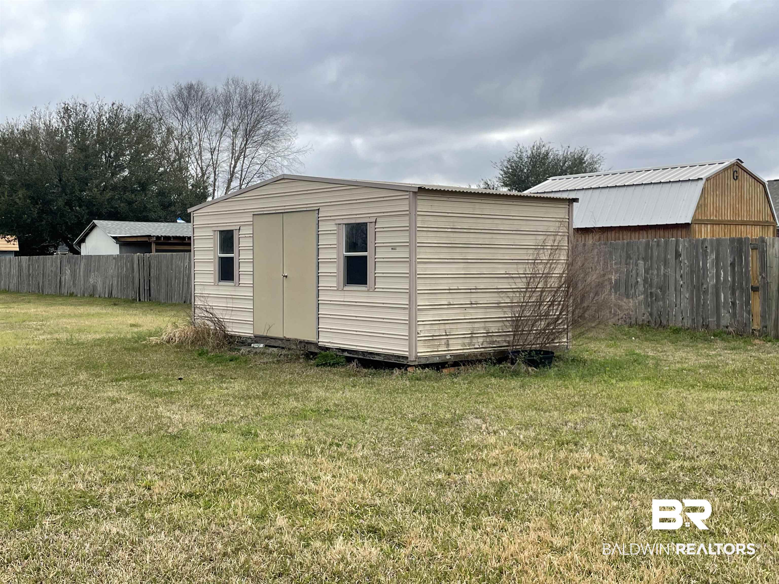 23575 Fountain Street Robertsdale, AL 36567 - Photo 14 of 19 View of shed with fence