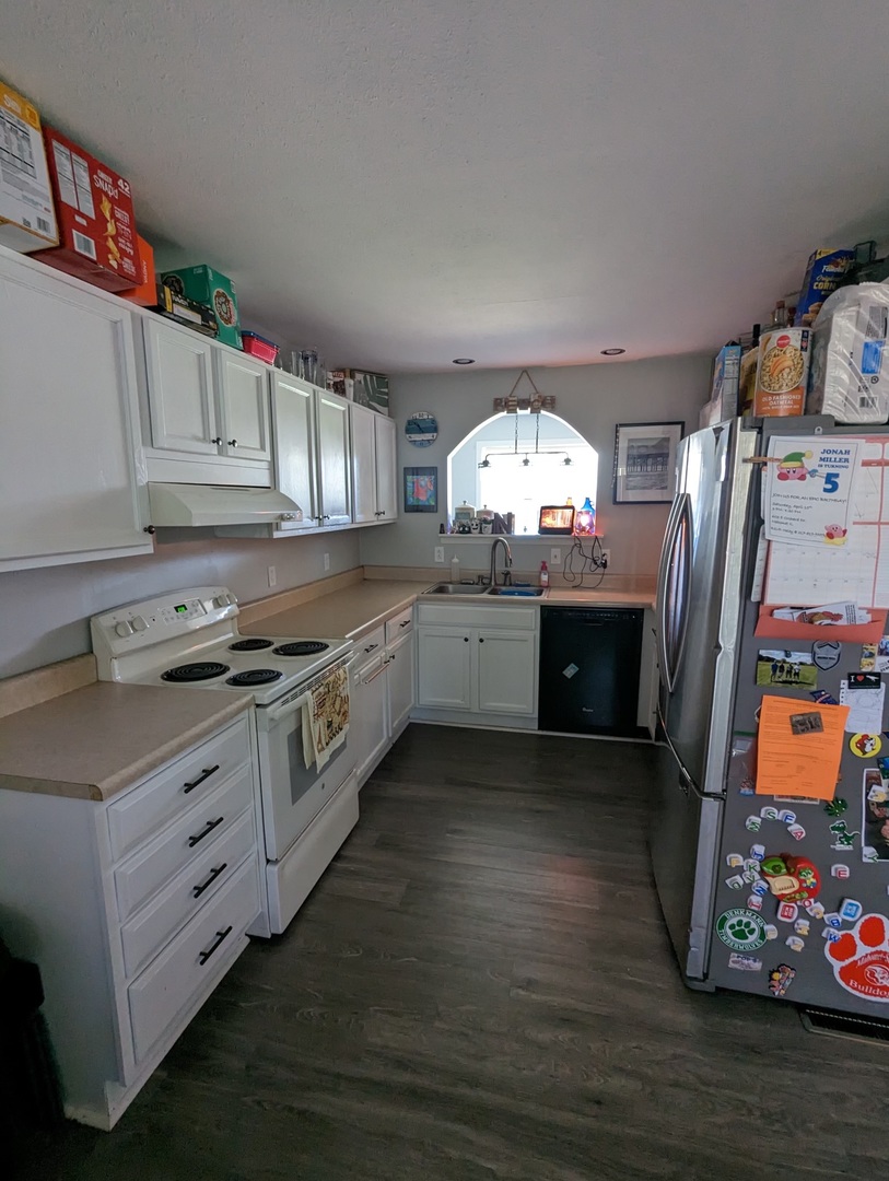 402 East South Mahomet Road Mahomet, IL 61853 - Photo 11 of 21 a kitchen with stainless steel appliances granite countertop a stove a sink and a refrigerator