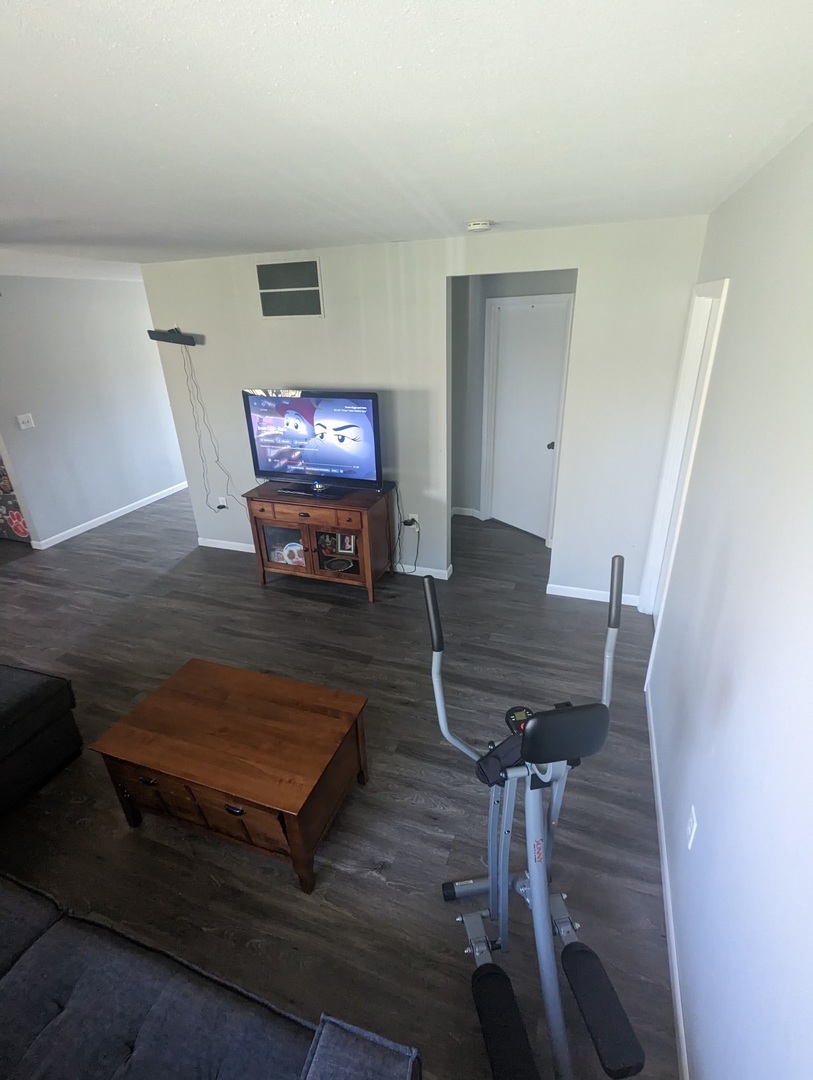 402 East South Mahomet Road Mahomet, IL 61853 - Photo 15 of 21 a living room with furniture and a flat screen tv
