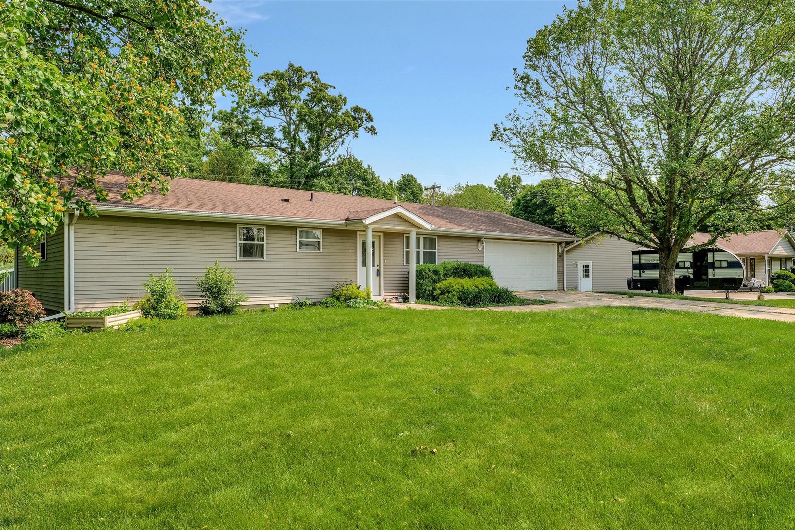 402 East South Mahomet Road Mahomet, IL 61853 - Photo 2 of 21 a front view of house with yard and green space