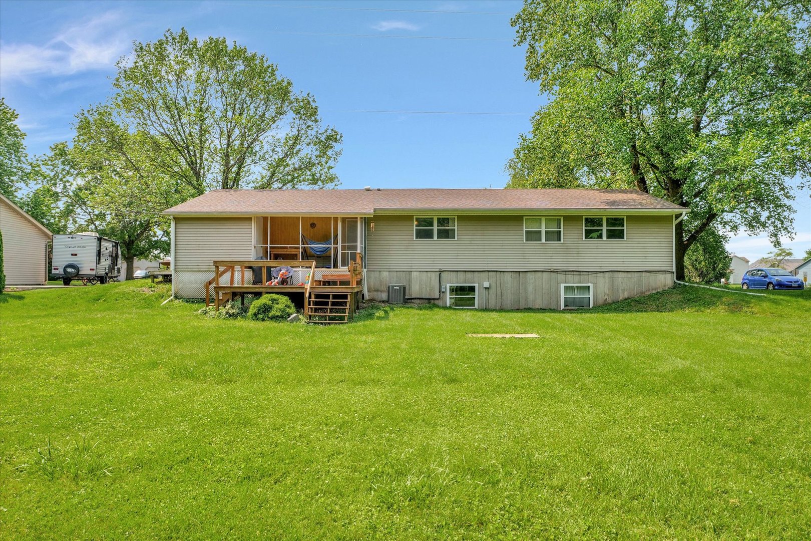 402 East South Mahomet Road Mahomet, IL 61853 - Photo 5 of 21 a view of a house with backyard sitting area and garden