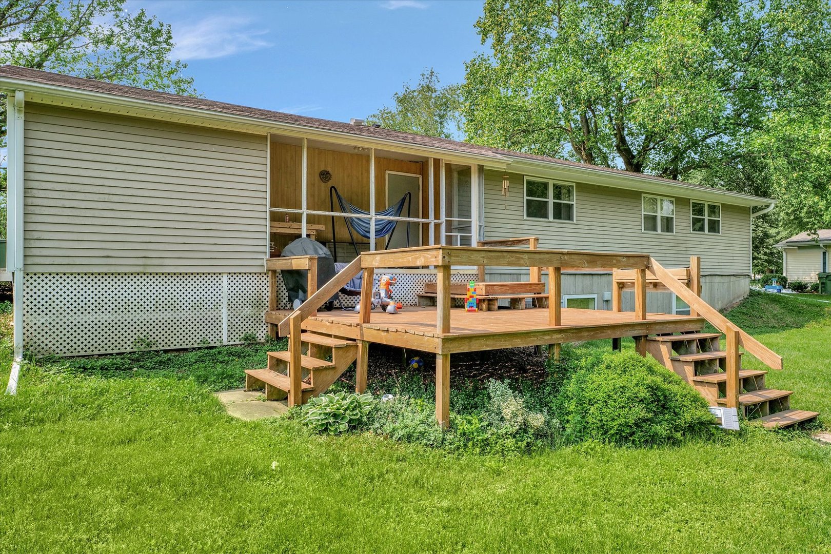 402 East South Mahomet Road Mahomet, IL 61853 - Photo 7 of 21 a front view of a house with a yard table and chairs