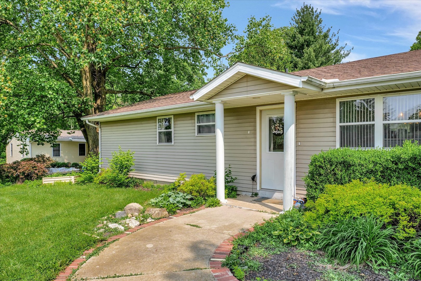 402 East South Mahomet Road Mahomet, IL 61853 - Photo 9 of 21 a view of a house with a yard