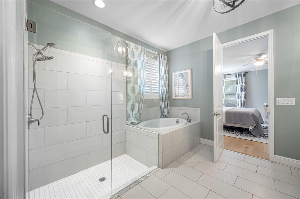 19709 Long Lake Ranch Boulevard Lutz, FL 33558 - Photo 23 of 59 a spacious bathroom with a tub shower and yard