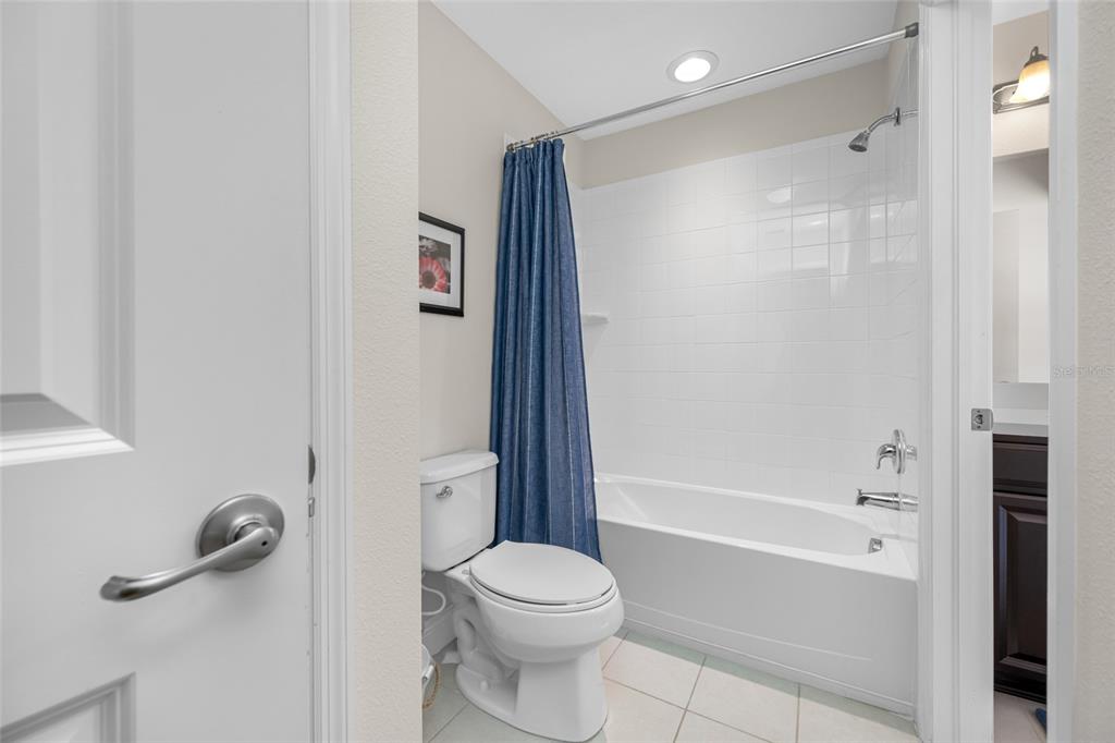 19709 Long Lake Ranch Boulevard Lutz, FL 33558 - Photo 38 of 59 a bathroom with a toilet and a shower