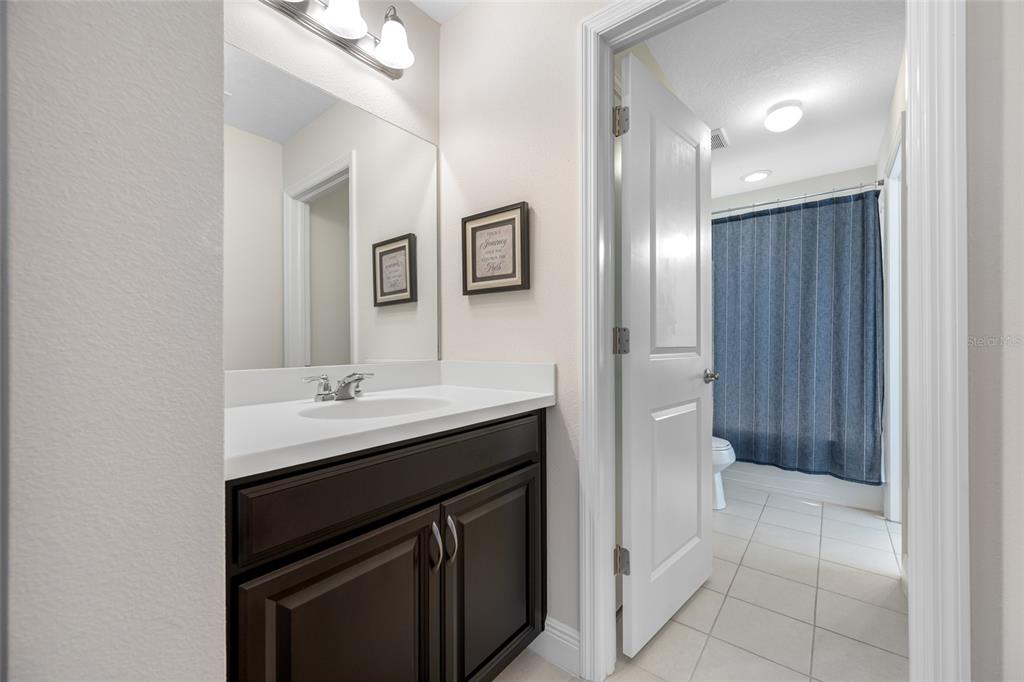 19709 Long Lake Ranch Boulevard Lutz, FL 33558 - Photo 40 of 59 a kitchen with a sink and a mirror