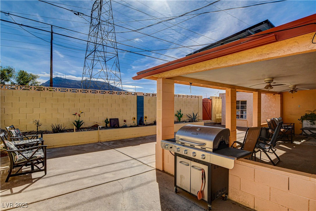 239 West Basic Road Henderson, NV 89015 - Photo 31 of 43 View of patio with area for grilling, a fenced backyard, ceiling fan, and a grill