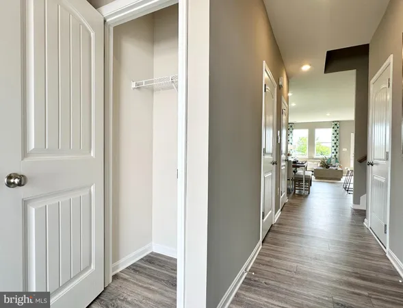 a view of a hallway with the wooden floor