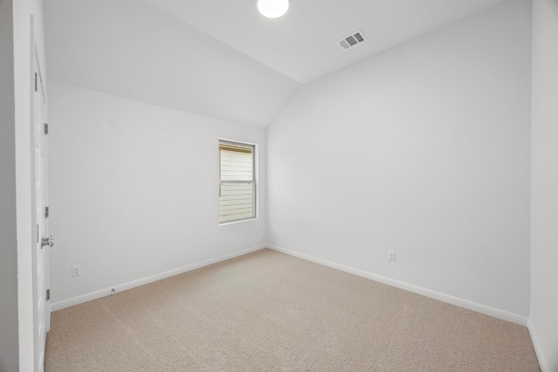 437 Lucky Avenue Elgin, TX 78621 - Photo 20 of 35 a view of an empty room and a window