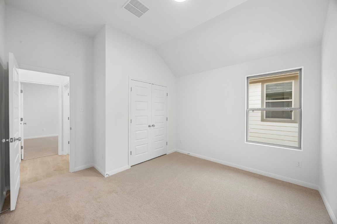 437 Lucky Avenue Elgin, TX 78621 - Photo 21 of 35 an empty room with windows
