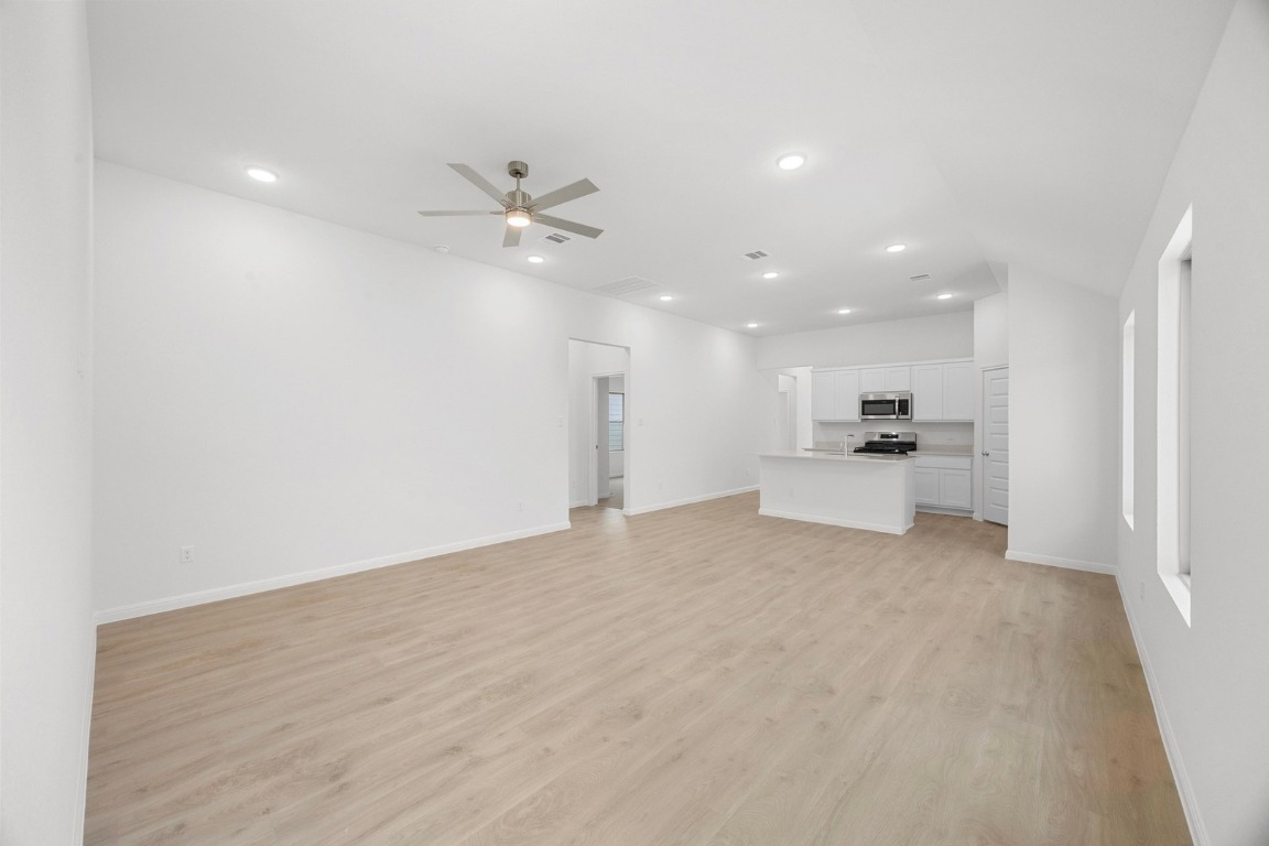 437 Lucky Avenue Elgin, TX 78621 - Photo 6 of 35 a view of kitchen with refrigerator and a sink