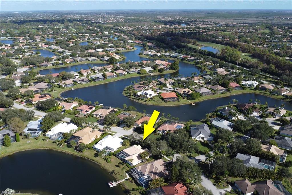 11079 Phoenix Way Naples, FL 34119 - Photo 17 of 30 Aerial view of property's location featuring a nearby body of water and nearby suburban area