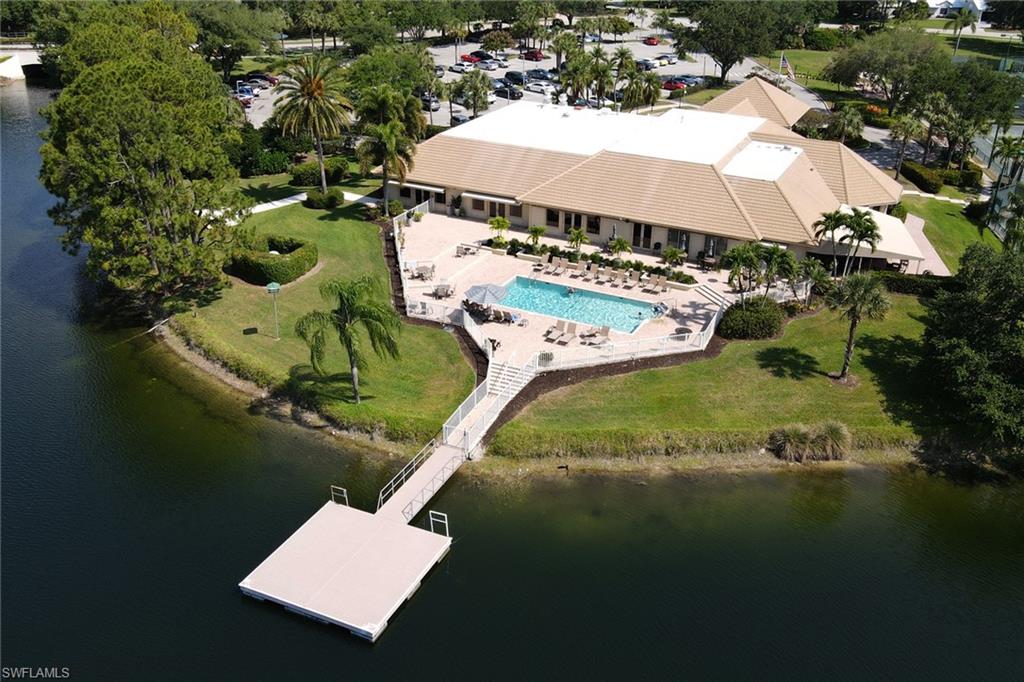 11079 Phoenix Way Naples, FL 34119 - Photo 28 of 30 Drone / aerial view of a nearby body of water and a pool