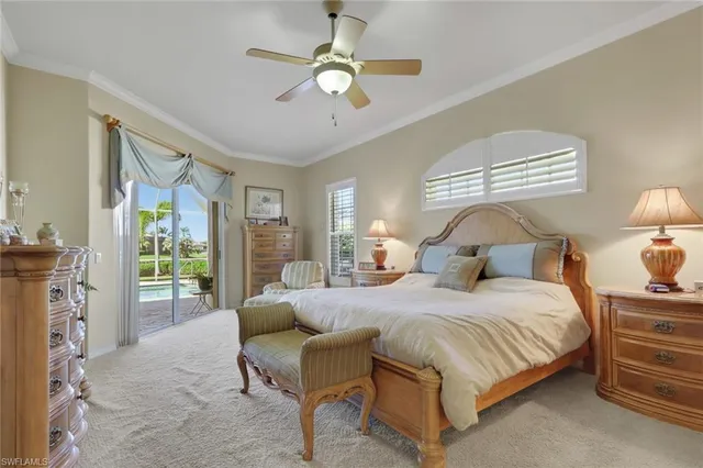 a bedroom with a bed couch and window