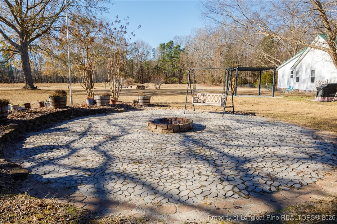 2574 Norrington Road Lillington, NC 27546 - Photo 19 of 50 a view of a large yard with trees