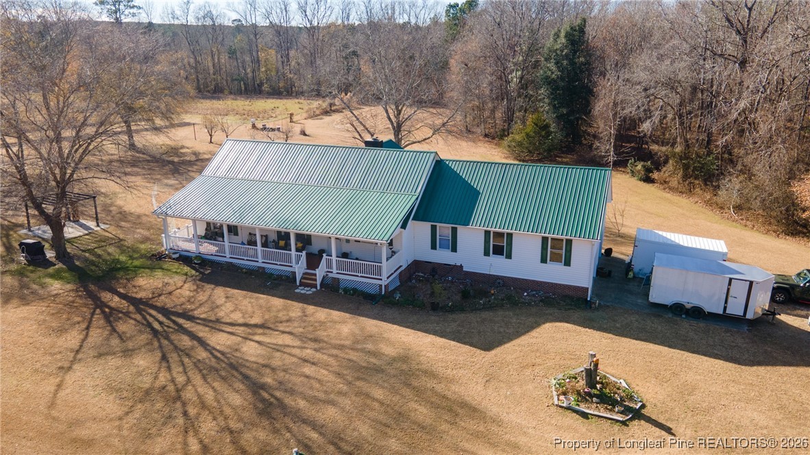 2574 Norrington Road Lillington, NC 27546 - Photo 2 of 50 a view of a house with a yard covered in snow