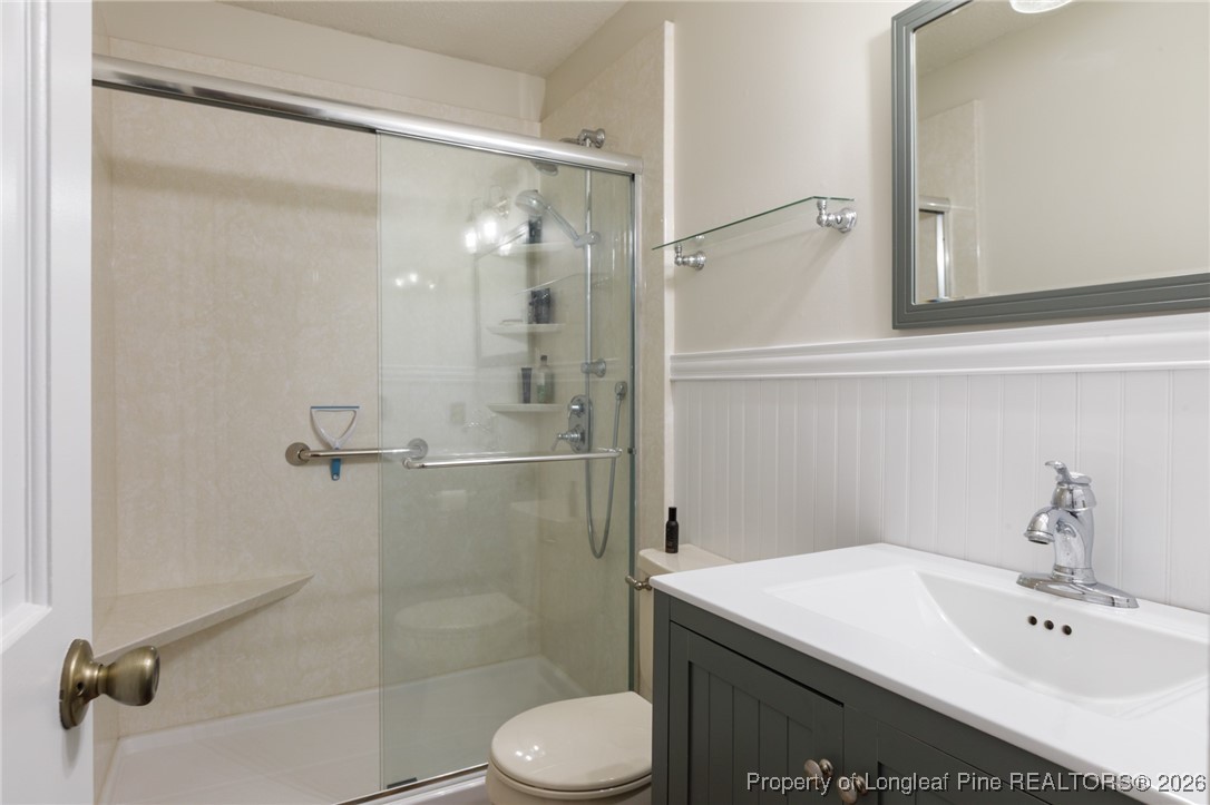 2574 Norrington Road Lillington, NC 27546 - Photo 21 of 50 a bathroom with a sink toilet and shower