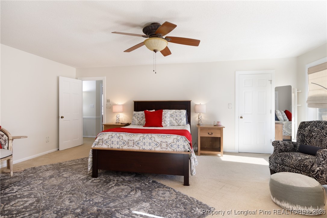 2574 Norrington Road Lillington, NC 27546 - Photo 24 of 50 a bedroom with a bed and a couch