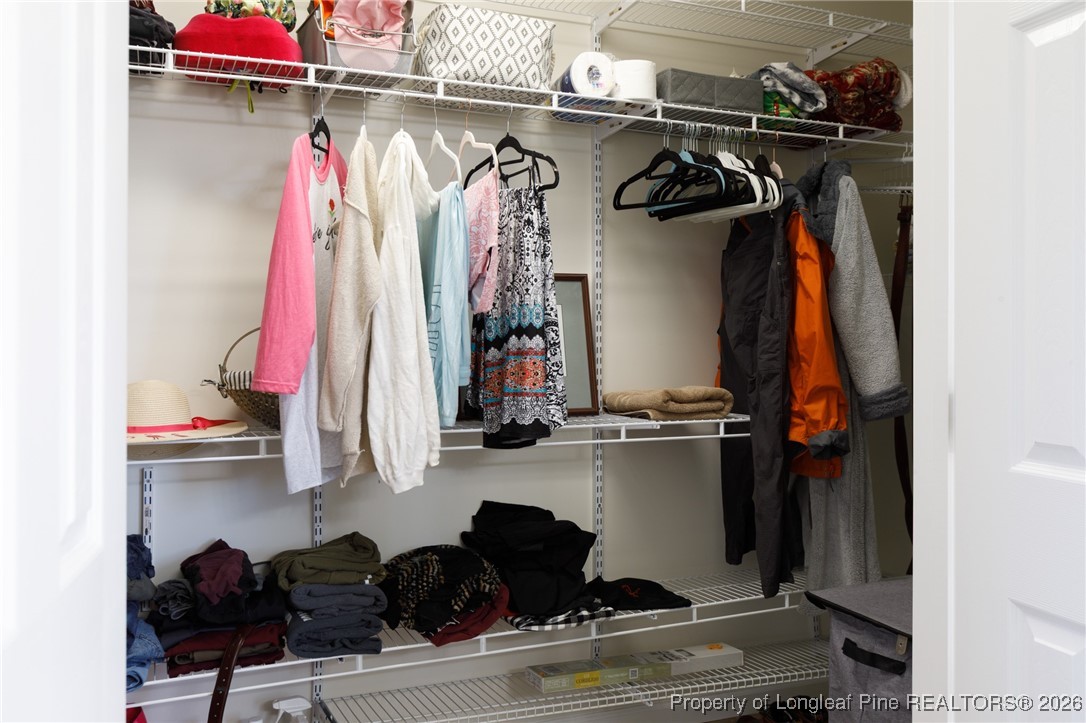 2574 Norrington Road Lillington, NC 27546 - Photo 28 of 50 a view of walk in closet with clothes and shoes