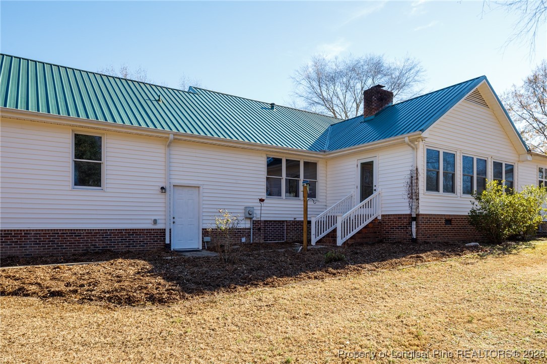 2574 Norrington Road Lillington, NC 27546 - Photo 30 of 50 a front view of a house with a yard