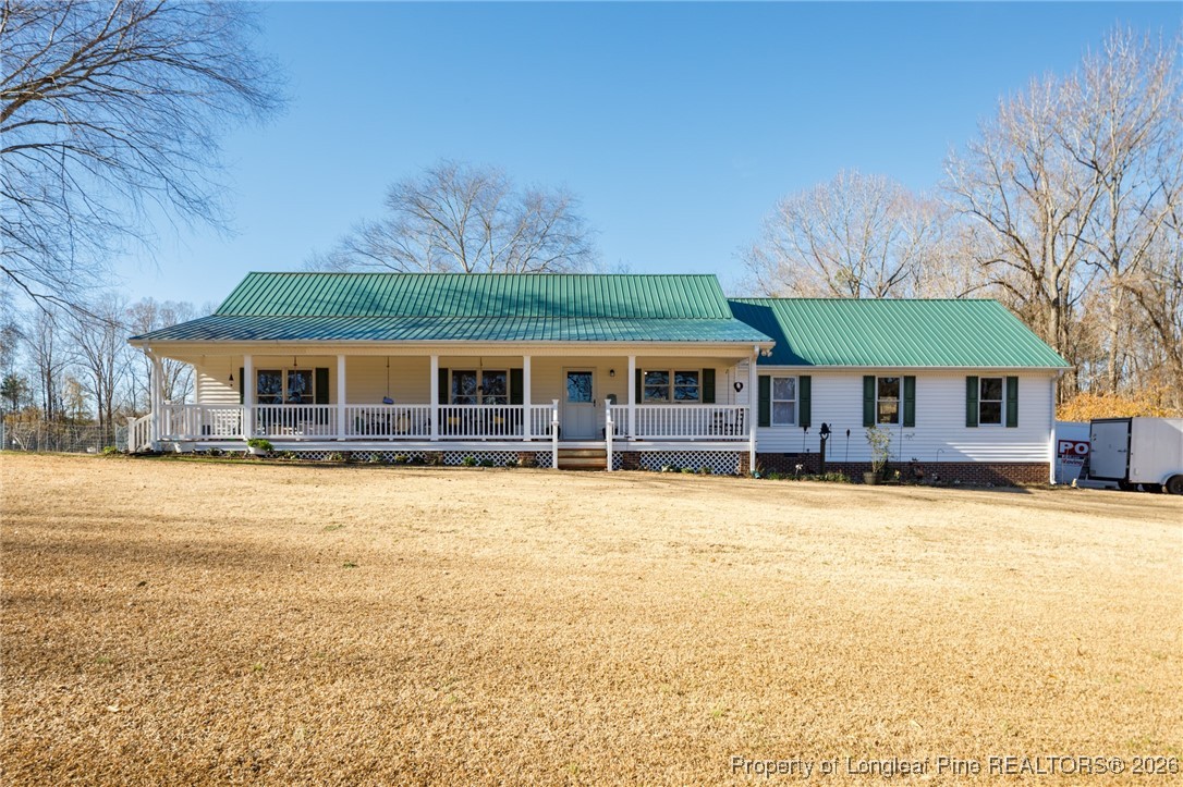 2574 Norrington Road Lillington, NC 27546 - Photo 3 of 50 a front view of a house with a yard