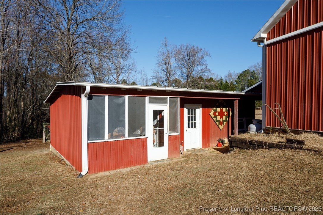 2574 Norrington Road Lillington, NC 27546 - Photo 44 of 50 a view of a house with backyard and sitting area