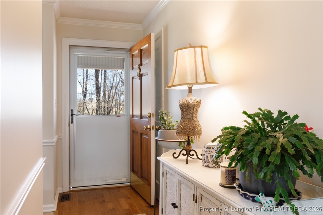 2574 Norrington Road Lillington, NC 27546 - Photo 5 of 50 a room with a potted plant next to a window