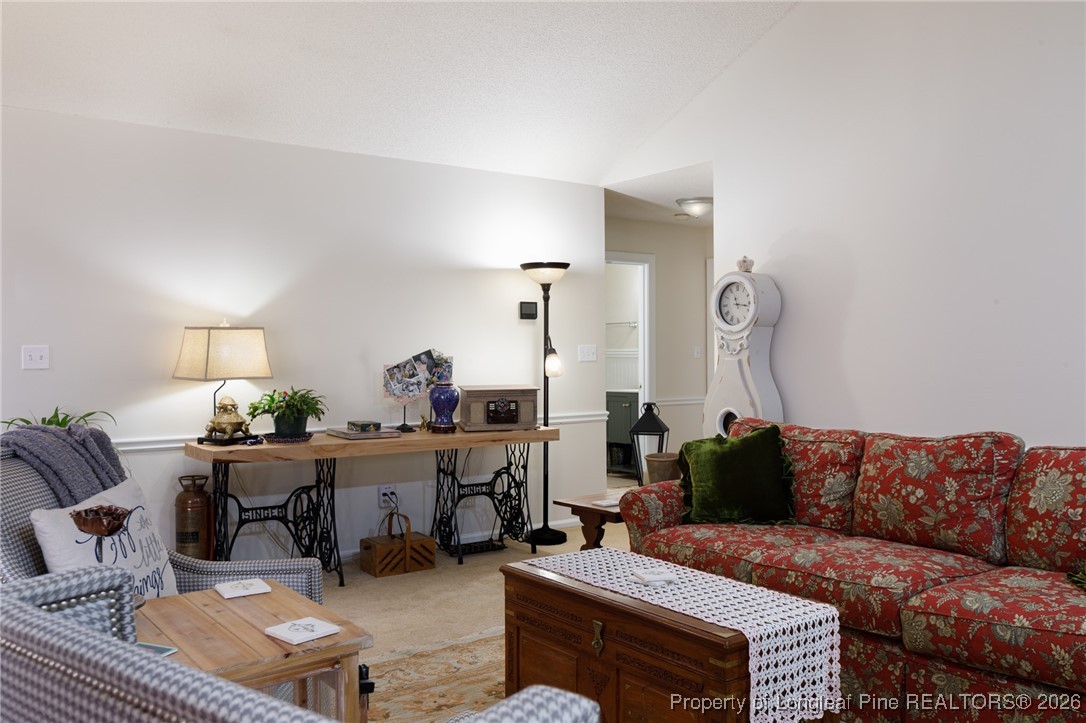 2574 Norrington Road Lillington, NC 27546 - Photo 7 of 50 a living room with furniture and wooden floor